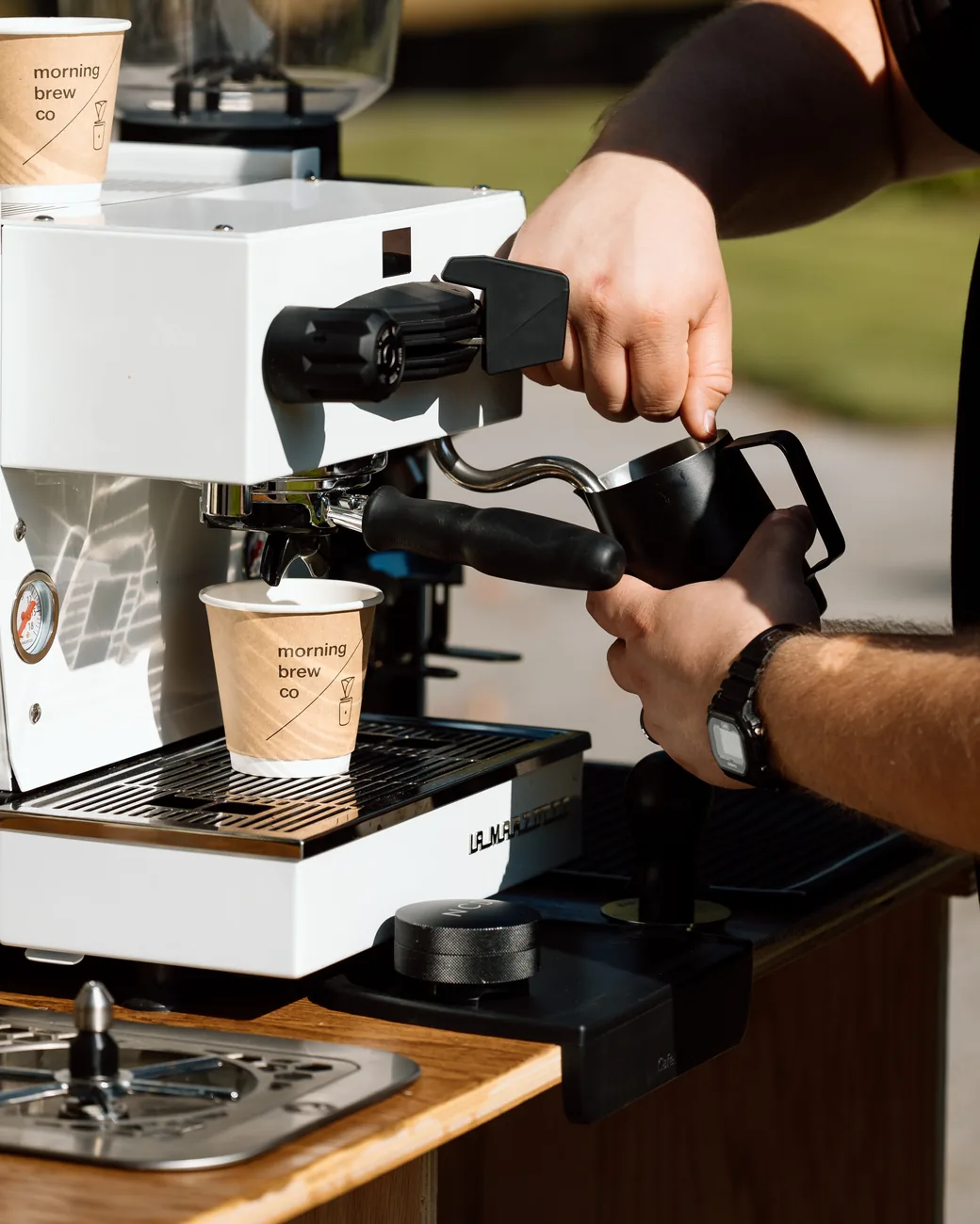 A shot pulling into a Morning Brew Co cup on the cart espresso machine