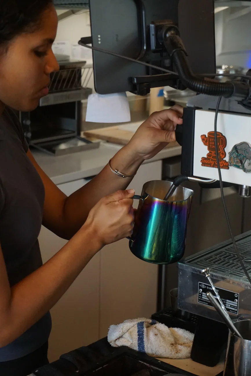 Milk poured from a jug into a cup at the Morning Brew Co espresso machine