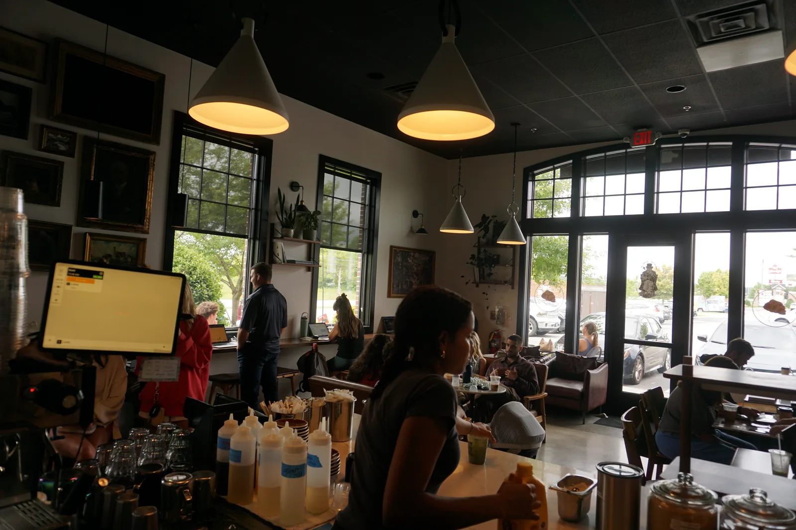 The room at Morning Brew Co mid morning, the counter busy and every table taken